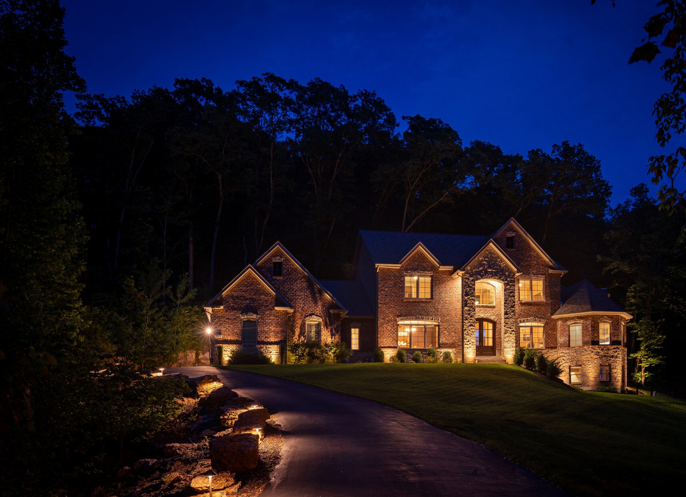 Beautifully uplit St. Louis home at dusk
